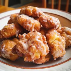 a plate full of donuts covered in icing