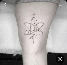 a black and white photo of a tattoo on the leg