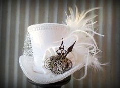 Gorgeous.  White Wedding Queen Bee Steampunk Mini Top Hat Alice by ChikiBird, $58.00 Bridal Party Hats, Steampunk Home Decor, Bridal Shower Cake Topper, Mad Hatter Hat, Mad Hatter Hats, Steampunk Hat, Steampunk Wedding, Steampunk Cosplay