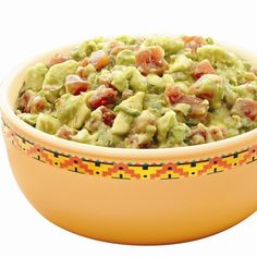 guacamole in a yellow bowl with the words recipe guacamole