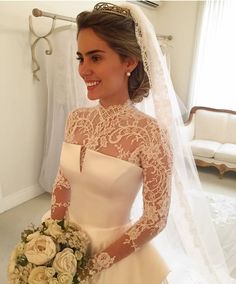 a woman in a wedding dress holding a bouquet