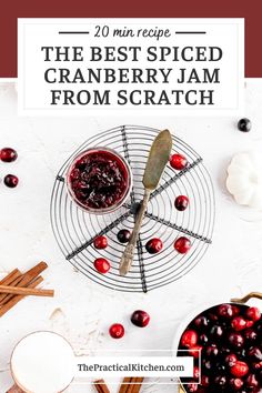 cranberry jam on a wire rack with spoons and cinnamon sticks