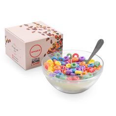 a bowl filled with cereal next to a box