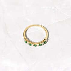 Beautifully crafted emerald ring is a true stunner! Looks great stacked or on its own! Made of 925 Sterling Silver We use a THICK plating of 14k Gold or Rhodium Available in sizes 4-10 Nickel-free & Hypoallergenic - Will not turn your fingers green! Made of the highest grade cubic zirconia for an authentic look! 14k Gold Green Half Eternity Ring, Green Half Eternity Ring In 14k Gold, Green 14k Gold Half Eternity Rings, 14k Gold Green Half Eternity Jewelry, Green 14k Gold Half Eternity Jewelry, 14k Gold Emerald Half Eternity Ring For May Birthstone, 14k Gold Half Eternity Emerald Ring For May Birthstone, Classic Green Jewelry For Promise Occasions, Fine Jewelry Green Emerald Cut Stackable Rings