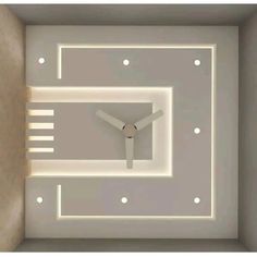 a clock is shown in the middle of a room with white lights on the ceiling