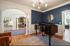 a living room with a piano in it