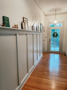 the hallway is clean and ready to be used as a place for pictures or other things