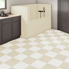 a bathroom with a checkered tile floor and white counter tops, along with black cabinets