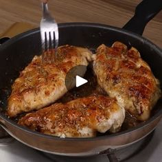 a video demonstrating how to cook chicken in a skillet with a fork and knife