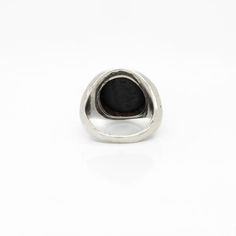 A fine antique signet ring.  In solid silver.  Bezel-set with an antique 18th Century Wedgwood & Bentley black basalt stoneware intaglio seal.  The intaglio depicts Harpocrates standing in the boat of the Sun.  Marked to the reverse Wedgwood & Bentley and with the model no. 136.  For the comparisons - please see the related intaglio in the British Museum's collection: inventory no. 1887,0307,I.392..  Harpocrates is also Horus, the Egyptian god of the sun. He's wearing a corn measure on his head, the club of Hercules in his left hand, and is in a boat of papyrus with two peacock head terminals.   Simply a wonderful antique Wedgwood & Bentley ring!  Date: Late 18th Century  Condition Details: There is a light tear to the bezel, two marks to the top, and light surface wear throughout. Otherwi Antique Carved Signet Ring, Classic Carved Signet Ring For Formal Occasions, Classic Sterling Silver Intaglio Ring, Classic Engraved Signet Ring For Memorial, Black Etched Rings For Formal Occasions, Formal Black Etched Rings, Antique Carved Sterling Silver Signet Ring, Classic Carved Silver Signet Ring, Luxury Carved Silver Signet Ring