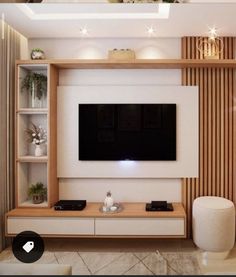 an entertainment center with a flat screen tv mounted on it's wall, in a living room