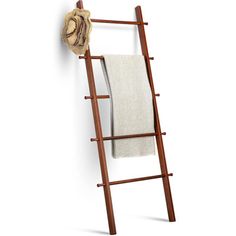 a wooden towel rack with two towels hanging on it's sides and a hat resting on top