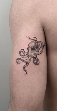 an octopus tattoo on the left thigh