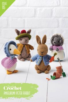 the crochet amigurm peter rabbit is standing next to other stuffed animals