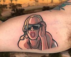 a woman with sunglasses and headphones on her arm is depicted in this tattoo design