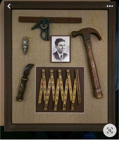 an old framed photo with tools and pictures on it