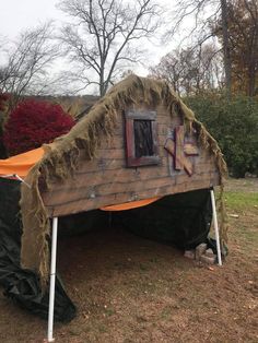 a tent that has been made to look like it is being used as a shelter