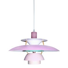 a pink and white lamp hanging from a ceiling