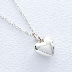 "Puffy Heart Sterling Silver Necklace, FREE SHIPPING, Mothers Day Heart, Valentines Heart Jewelry, Bridesmaid Heart, Love Friendship Necklace A shiny, smooth, high polished sterling silver puffy heart pendant is suspended from your choice of box or petite cable chain. This necklace makes a charming flower girl gift, bridesmaid gift, birthday gift, or just to say I love you, and it is perfect for anyone for any occasion. OVERVIEW: * Beautiful, elegant, bright and sturdy 14, 16, 18, 20, or 22 inch Puffy Heart Charms, Friendship Necklace, Heart Valentines, Jewelry Bridesmaid, Friendship Necklaces, Flower Girl Gifts, Puffy Heart, Necklaces Jewelry, 925 Sterling Silver Chain