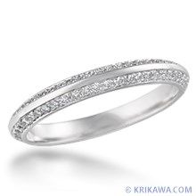 a white gold wedding band with pave set diamonds