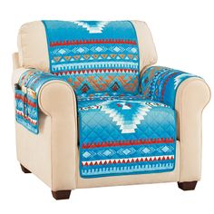 a chair with a blanket on it and a pillow in the armrest that has an southwestern design