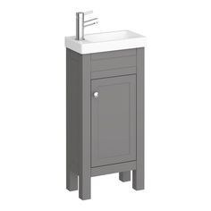 a bathroom sink with a cabinet underneath it and a faucet on the side