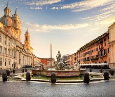 a fountain in the middle of a city square