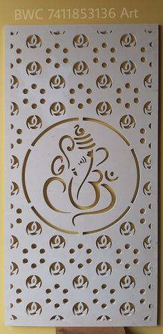 an intricately designed metal plaque with the word bwc in gold and white on it