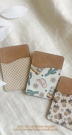 three small wallets sitting next to each other