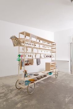 a bike is parked next to a shelf with jewelry on it