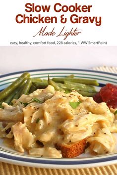 a white plate topped with pasta and green beans