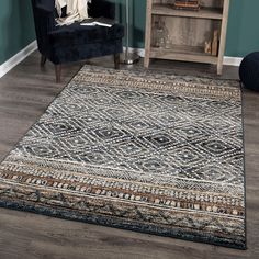 a large area rug in a living room with a chair and bookcase behind it