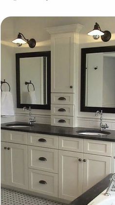 a bathroom with double sinks and two mirrors on the wall next to a bathtub