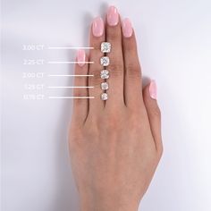 a woman's hand with five diamonds on it and measurements for the ring size