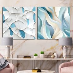 three paintings on the wall in a living room with two chairs and a coffee table