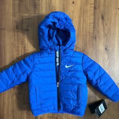 Baby's Nike Jacket Size: 18m Blue Hooded Jacket For Spring Cold Weather, Blue Hooded Jacket For Cold Spring Weather, Blue Puffer Jacket With Fleece Lining, Blue Outerwear With Fleece Lining For Cold Weather, Blue Hooded Outerwear For Playtime, Blue Long Sleeve Puffer Jacket With Fleece Lining, Blue Fleece-lined Puffer Jacket For Fall, Blue Nike Outerwear For Fall, Nike Blue Outerwear For Fall