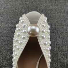 SPECIFICATIONS Indulge in a luxurious look with these pearl studded heels sandals! Crafted with comfortable PU upper material, these sandals feature an open toe style and solid pattern, with just the right heel height (3cm-5cm). You are sure to turn heads while your feet are cradled in total comfort with a rubber outsole, PU lining, and rubber insoles. Slip-on fit true to size for the perfect casual evening look! With Platforms: No Upper Material: PU Toe style: open toe heels Size: 34 35 36 37 3 Elegant Pearl-embellished Open Toe Sandals, Party Heels With Pearl Material And Open Toe, Elegant Pearl Sandals For Party, Pearl Open Toe Wedding Shoes For Formal Occasions, Formal Open Toe Pearl Wedding Shoes, Elegant Pearl Embellished Open Toe Wedding Shoes, Elegant Pearl-embellished Open Toe Wedding Shoes, Formal Pearl Open Toe Wedding Shoes, Pearl Open Toe Heels For Evening