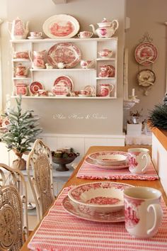 a dining room table with plates and cups on it