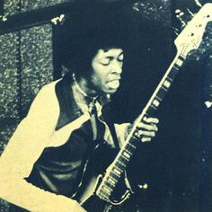 a man with an electric guitar in his hand