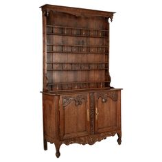 an old wooden cabinet with many shelves and drawers on the front, against a white background