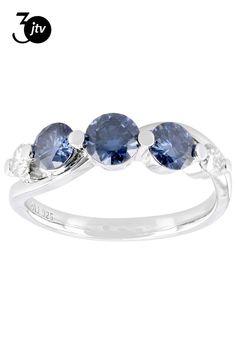 three stone ring in white gold with blue sapphire