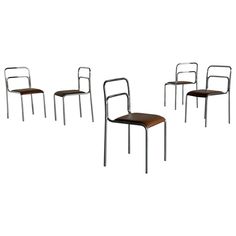 four chairs with metal frames and leather seat covers, all in different positions on a white background