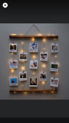 a wooden shelf with pictures hanging from it's sides and lights on the wall