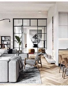 an image of a living room and dining area in the same house, which is on instagram