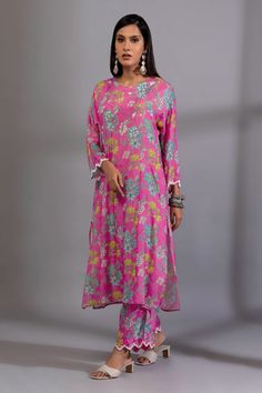 Rani pink kurta with floral digital print and sequin embroidered sleeve hem. Paired with pant.
Components: 2
Pattern: Digital Printed, Embroidery
Type Of Work: Floral, sequin
Neckline: Round
Sleeve Type: Long sleeves
Fabric: Cotton Silk
Color: Pink
Other Details: 
Cutwork sleeve hem
Side pockets
Embroidery on pant hem
Length:
Kurta: 45 inches
Pant: 37 inches
Occasion: Mehendi and Haldi - Aza Fashions Festive Pink Floral Print Palazzo Set, Pink Floral Print Festive Sets, Festive Pink Floral Print Sets, Pink Floral Print Palazzo Set With Straight Kurta, Pink Floral Print Straight Kurta Sets, Pink Pant Set With Straight Kurta, Traditional Pink Floral Print Sets, Unstitched Pink Sets With Printed Motifs, Traditional Pink Palazzo Set With Digital Print