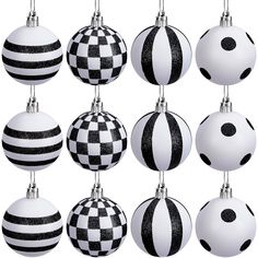 twelve black and white ornaments hanging from strings on a white background, each decorated with a checkerboard pattern