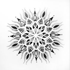 a black and white drawing of an intricate design on a white paper with dots in the middle