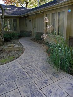 a house that has a walkway in front of it