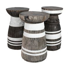 three wooden stools sitting next to each other