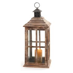 an old wooden lantern with a candle inside